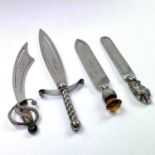 Four hallmarked silver novelty bookmarks, one by Charles Horner in the form of a Schimitar,