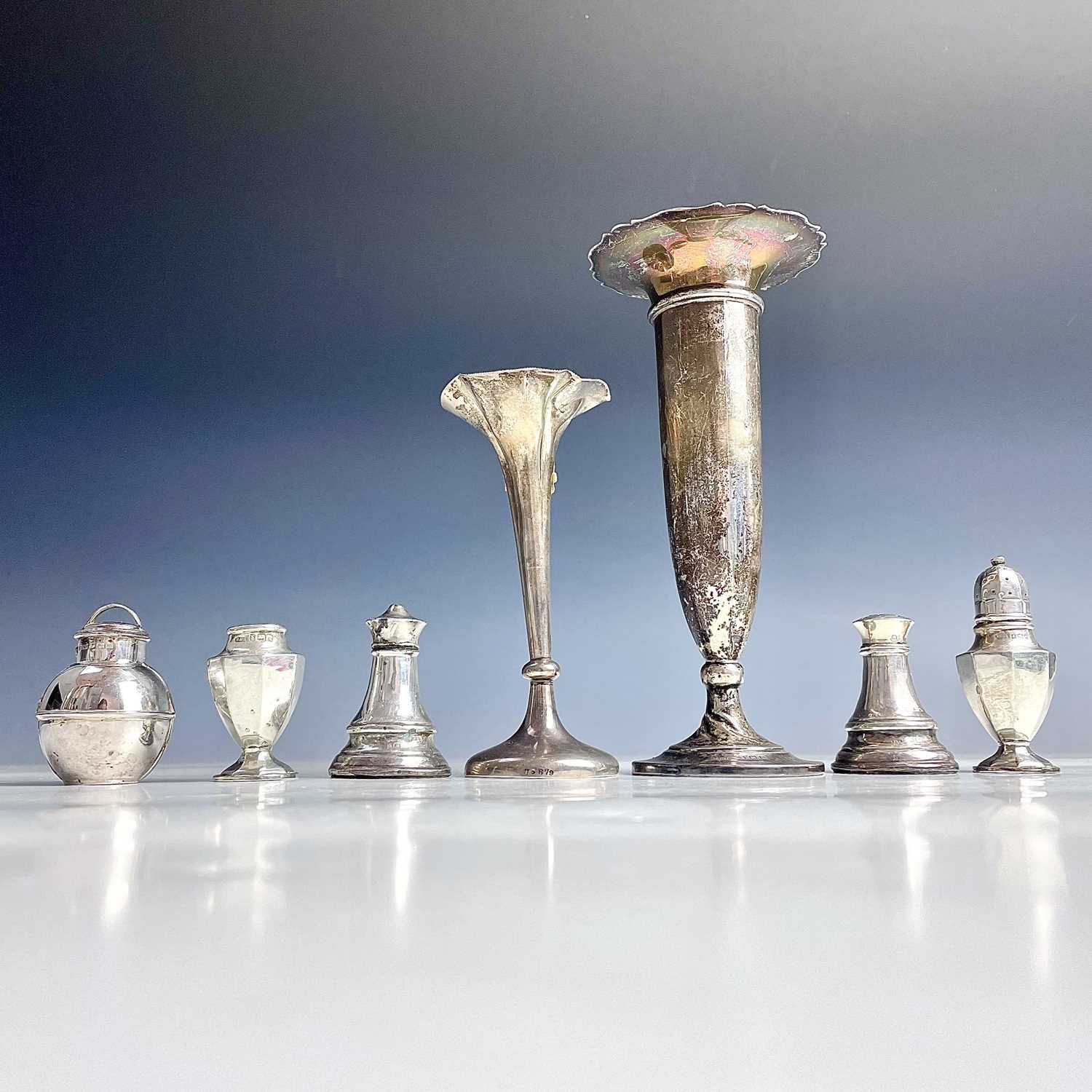 Mixed silver items to include two spill vases with weighted bases, a pair of Edwardian capstan