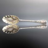 A George I silver berry spoon, with deeply foliate scroll engraved handle, indistinct makers mark,
