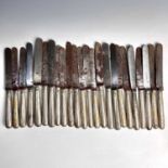 A George III harlequin set of 24 knives with steel blades and silver filled handles, lengths 20-