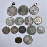 A collection of coins and medallions including a 1913 German Drei Mark and one other mounted, a