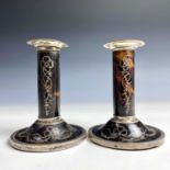A pair of George V silver and tortoiseshell pique candlesticks, height 12cm, indestinct makers mark,