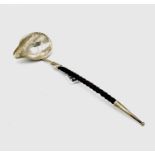 A Victorian silver toddy ladle with twisted baleen handle and silver finial, the bowl set with a