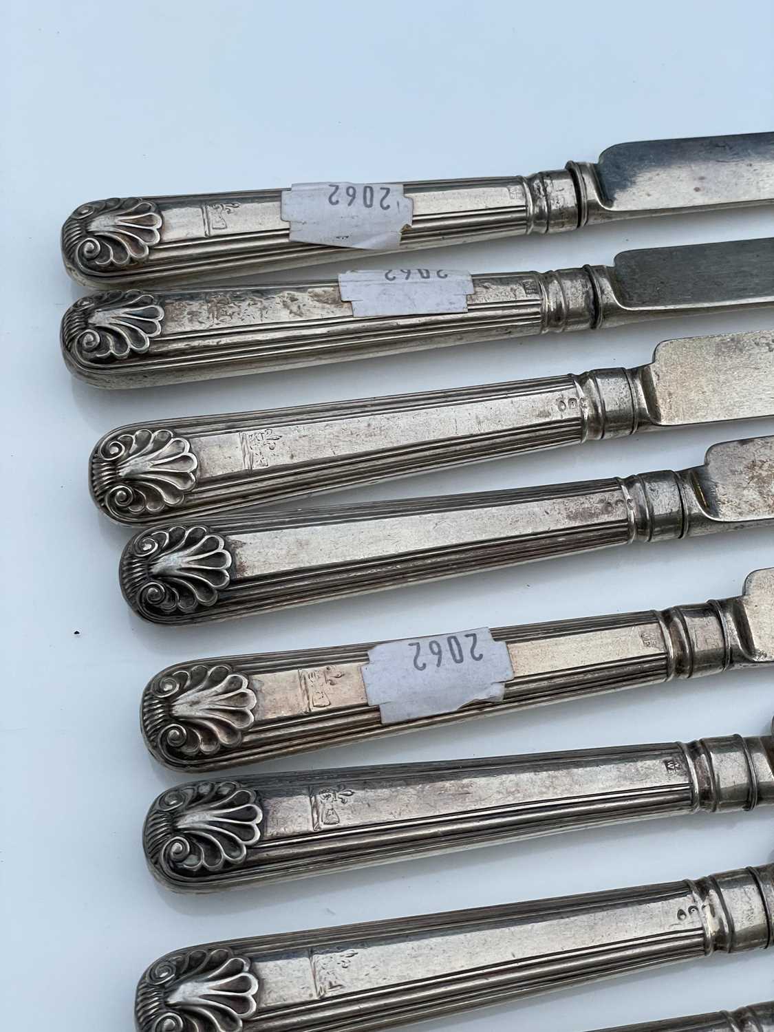 A George IV set of twelve shell and thread pattern dessert knives, with filled handles and silver - Image 4 of 8