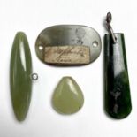 Four jadeite pendants, the longest 46mm.