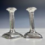 A pair of George V silver candlesticks by Ellis Jacob Greenburg, the cylindrical columns with ribbon