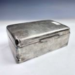 A George V silver cigarette box, engraved monogram to the hinged lid, London 1913, width 14.5cm,