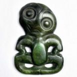 A rare Maori anthropomorphic hei-tiki pendant, green nephrite jade, possibly pounamu, the head