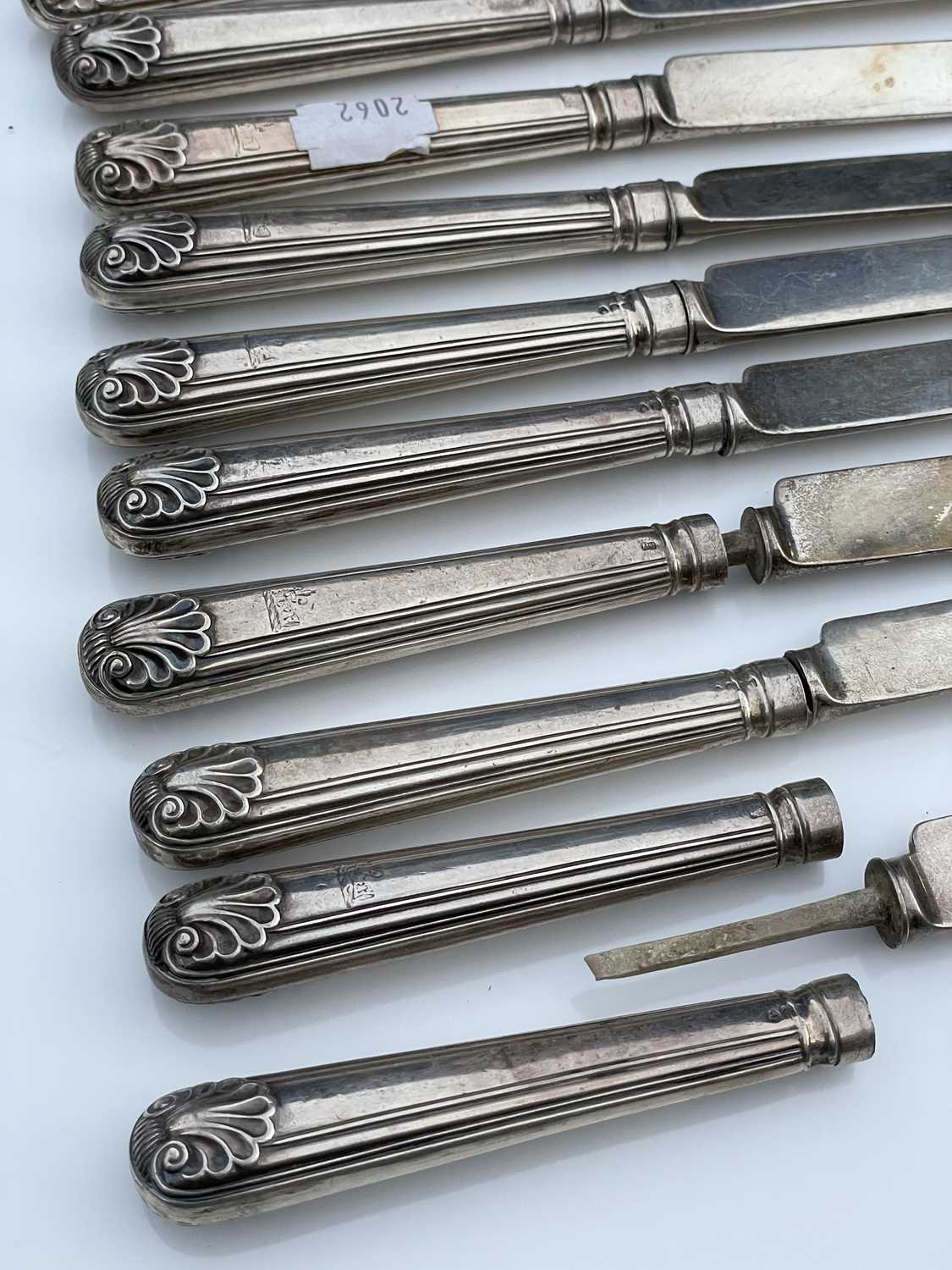 A George IV set of twelve shell and thread pattern dessert knives, with filled handles and silver - Image 5 of 8