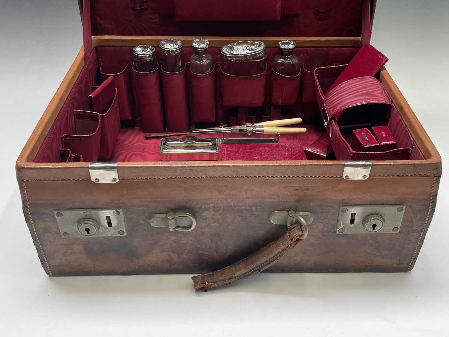 A tan leather toilet case by A. Davis & Co 10 Strand London , the red silk interior with five floral - Image 2 of 26