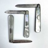 Three mother of pearl folding fruit knives with silver blades.