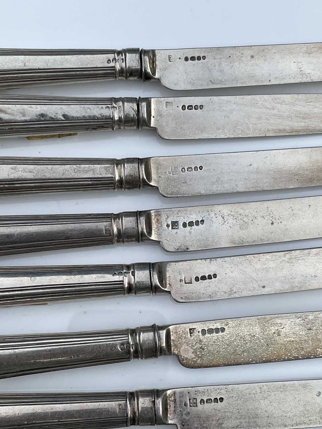 A George IV set of twelve shell and thread pattern dessert knives, with filled handles and silver - Image 2 of 8