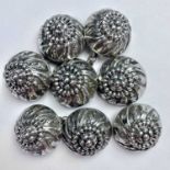 A set of four Continental silver cloak buttons, weight 36.2g.