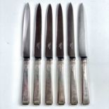 A George VI silver set of six fruit knives, with filled handles and steel blades, maker John