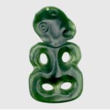 A Maori anthropomorphic hei-tiki pendant, green nephrite jade, the head tilted left, suspension hole