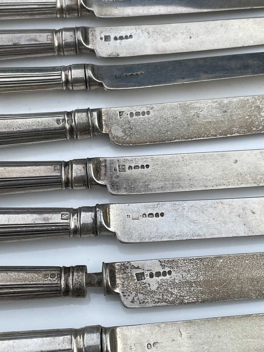 A George IV set of twelve shell and thread pattern dessert knives, with filled handles and silver - Image 6 of 8