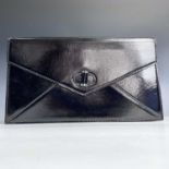 Alexander McQueen, a black patent leather clutch bag, width 30cm, cloth protective bag.
