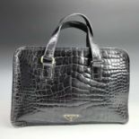 Prada, a black crocodile skin leather handbag, with plastic card, ref BN0959, width 31.5cm.Condition
