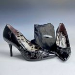 Dolce & Gabbana, a pair of black patent leather stiletto shoes, size 37, unworn, within protective