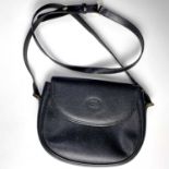 A Gucci black leather handbag with gilt metal hardware, ref. 007.58.0074, width 23cm.