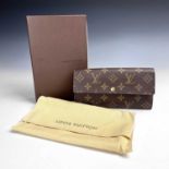 A Louis Vuitton purse, with original cloth bag and box, length 19cm, height 10cm.Condition report: