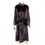 A good mink fur coat by Higgs Furs, with embroidered lining, size small.Condition report: