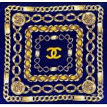 A Chanel printed silk scarf, 87cm square.Condition report: Generally good condition. No attached