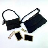 Two vintage French black suede ladies cosmetics handbags, both with gold plated accessories, the