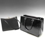 Anya Hindmarch, a black patent leather handbag, width 31cm, slight tear to bottom corner; together