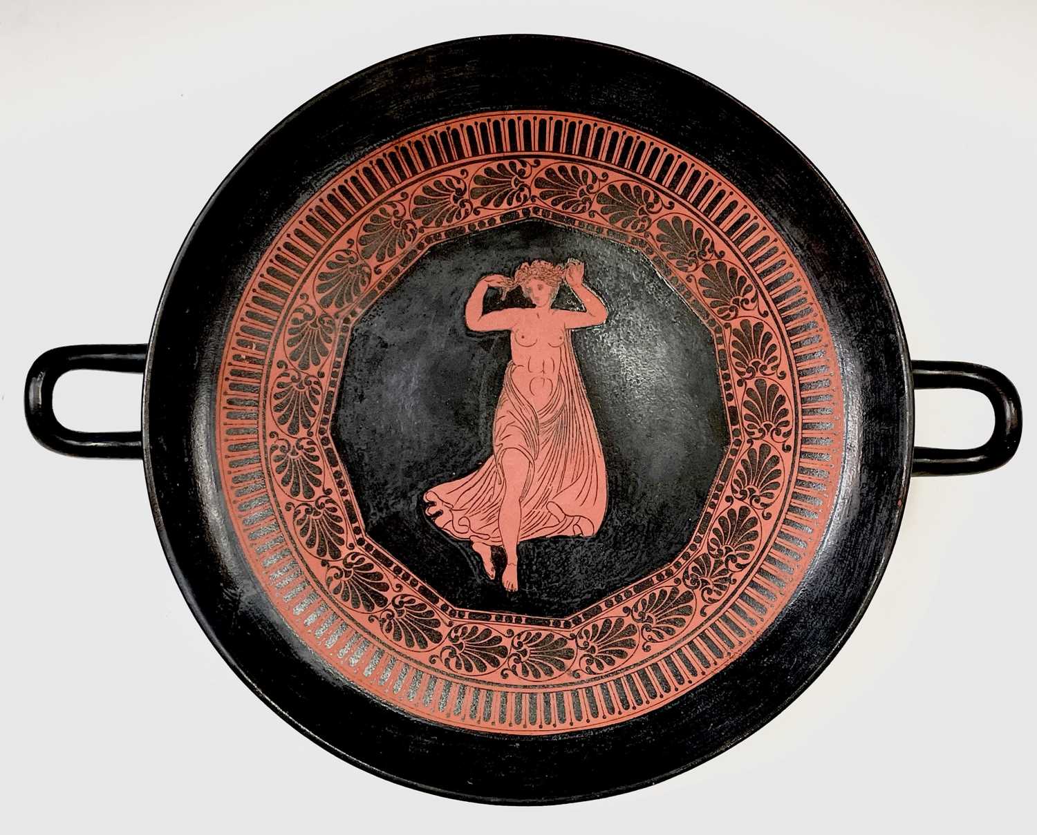 A Dillwyn's Etruscan ware twin handled tazza circa 1848-50, decorated with a partially naked dancing