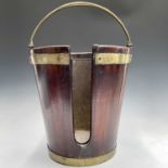 A George III mahogany and brass bound plate bucket, the brass swing handle with decorative scroll