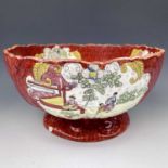 A 19th century Ironstone pottery punch bowl printed and overpainted in enamels printed mark to