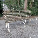 A wrought iron and slatted bench originally from Lord's cricket ground, length 182.5cm.