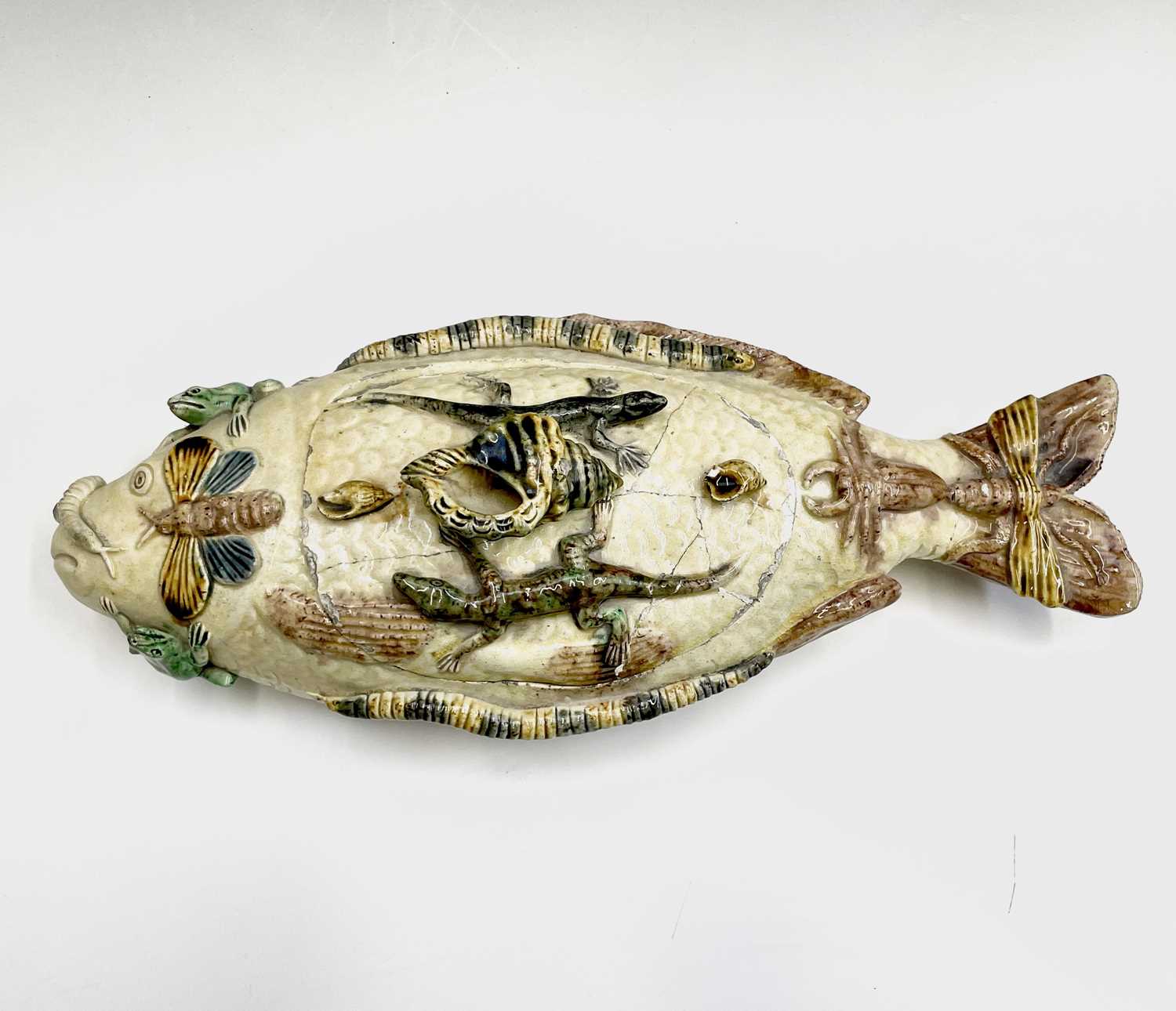 A Portuguese Pallisy style fish shaped tureen and cover, circa 1900, with applied shells, lizards,