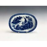A Caughley blue and white porcelain oval baking dish, circa 1780, printed with the Fisherman