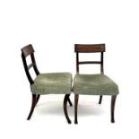 Pair Regency mahogany sabre leg dining chairs.