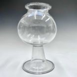 A Georgian blown glass leech jar, of globular form, on a reverse tapered stem with circular folded