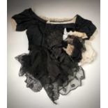 A late Victorian black silk boned bodice together with a collection of vintage lace and linens.