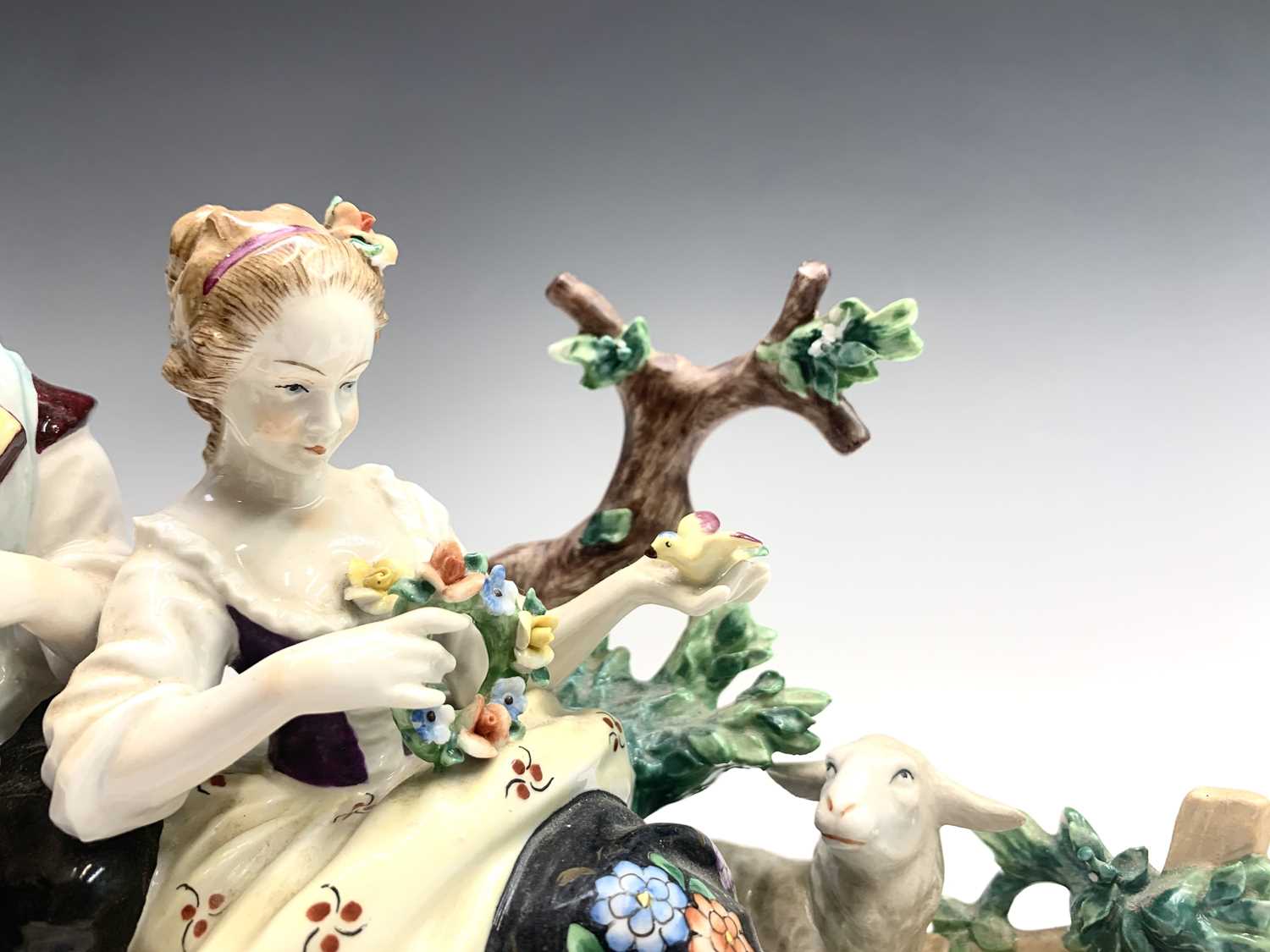 A German porcelain oil lamp base, circa 1900, modelled as a basket supported by three cherubs, - Image 7 of 10