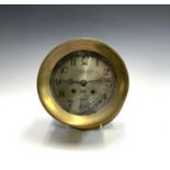 An American Chelsea clock Co 'Ship's Bell' bulkhead timepiece, with brass case, the silvered dial