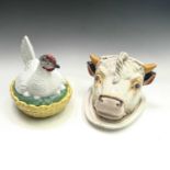 A Staffordshire cheese dish and cover, circa 1900, modelled as a bull's head, with painted detail,