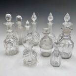 A set of three late Victorian cut glass decanters and stoppers, height 27.5cm, together with six