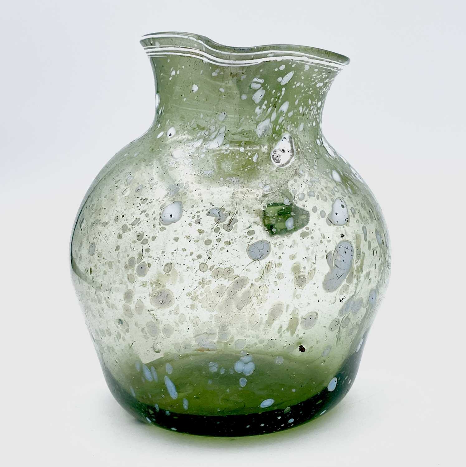 A Nailsea type glass jug, circa 1800, pale green with opaque white mottling, height 15cm.Provenance: - Image 4 of 5