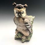 A French porcelain figure of an owl, late 19th century, with inset eyes and painted detail, with a