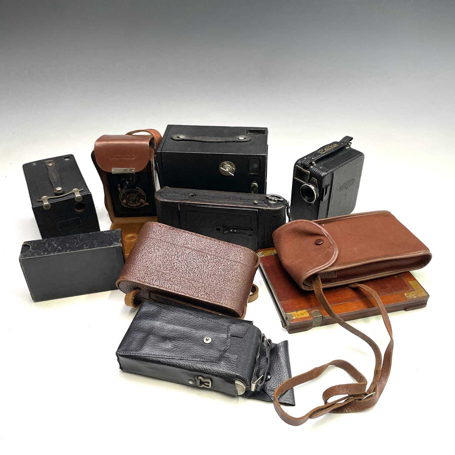 A collection of cameras and cinecameras including a Pathe Motocamera in leather case with