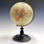 A Philip's 9 inch, terrestrial globe, on a turned ebonised stand, overall height 38cm.Condition
