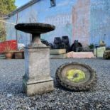 A cast metal sundial on a square reconstituted stone plinth, height 84cm, together with a birdbath