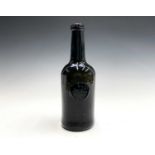 Plymouth Dock, A rare George III sealed wine bottle, olive green, with kick-in base and slightly