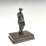 A bronze figure of a Classical maiden, late 19th century, on a Cornish serpentine rectangular