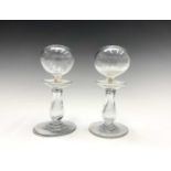 A near pair of glass lacemakers lamps, late 18/early 19th century, raised on open baluster stems and